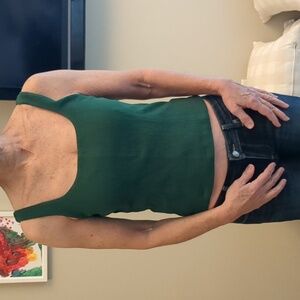 Anthropologie green top with black lace up detail on the back